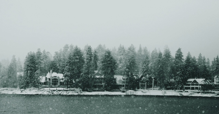 Lakeside homes in a winter storm.
