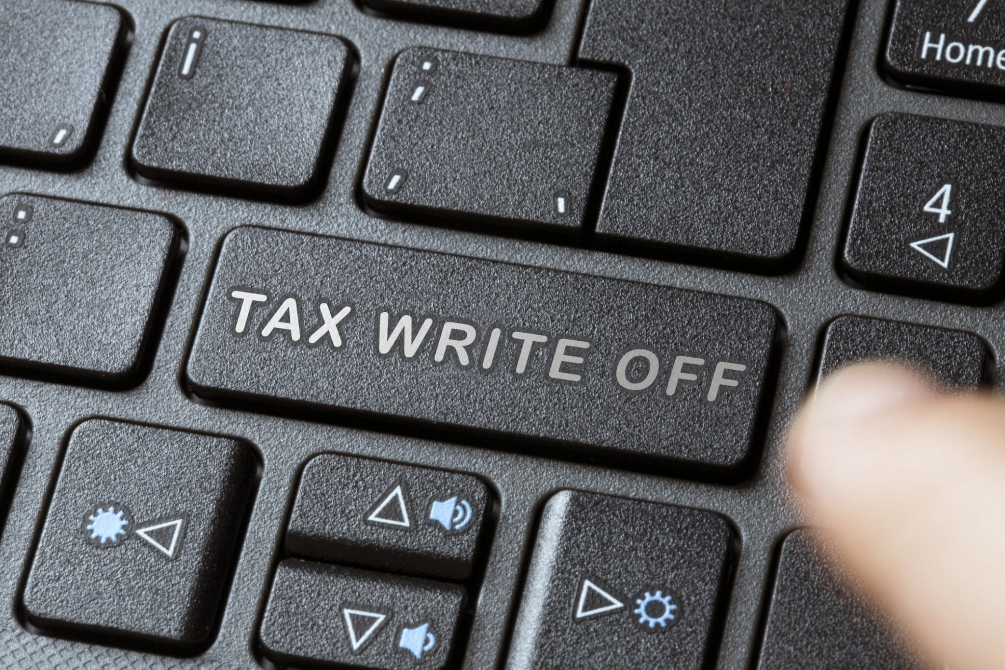 Keyboard with phrase "Tax Write Off" on the return button for the CARES Act generator deduction.